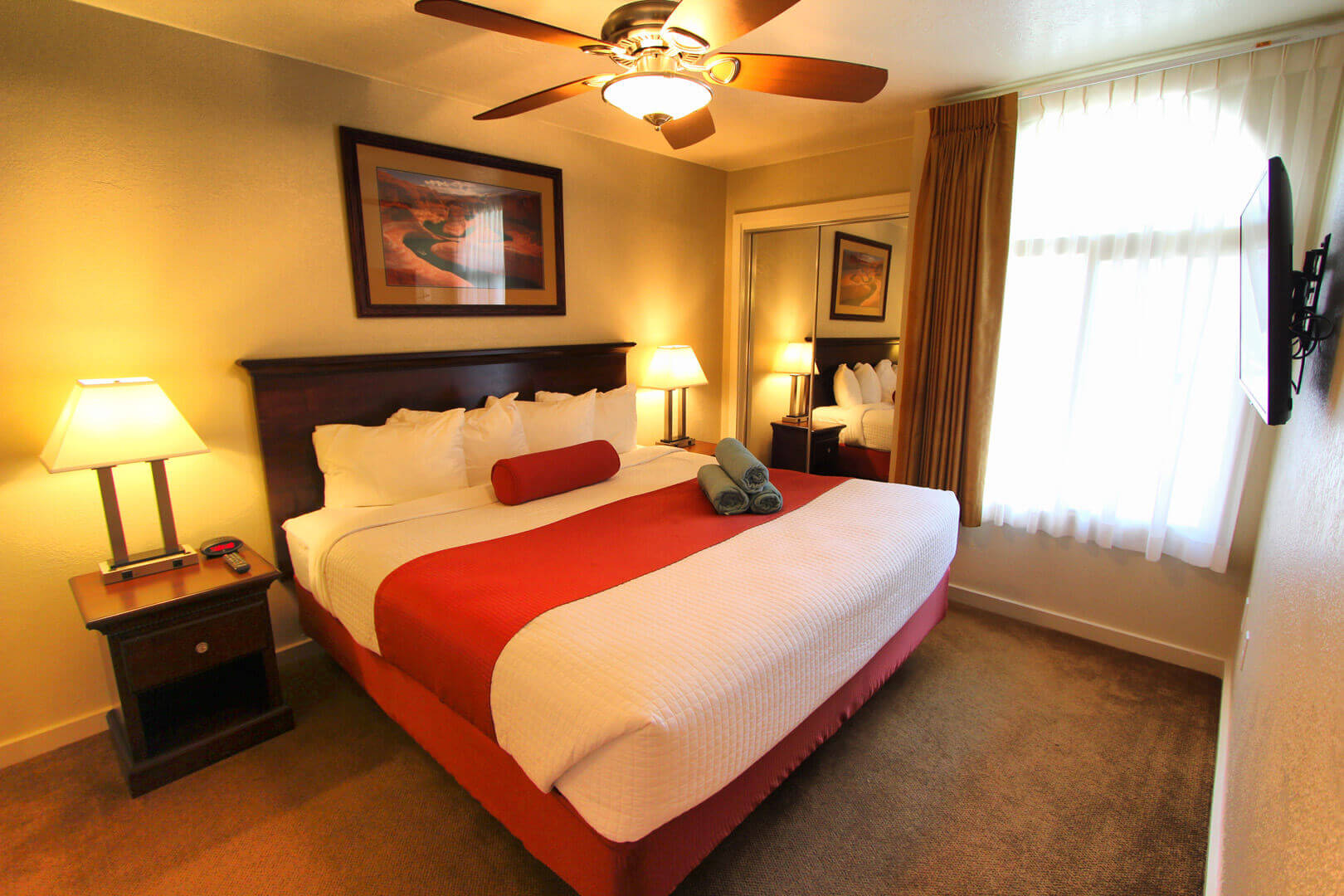 A colorful and renovated master bedroom at VRI's Villas at South Gate in St George, Utah.